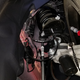 Toyota Supra double-joint spring strut front suspension as viewed from below and in the rear